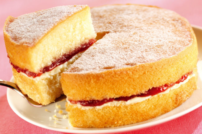 Close-up shot of sponge cake with raspberry filling. 